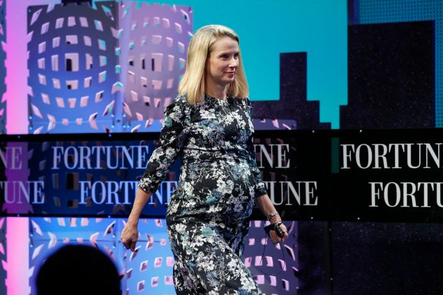 Marissa Mayer sports a baby bump while speaking at Fortune Global Forum last November.