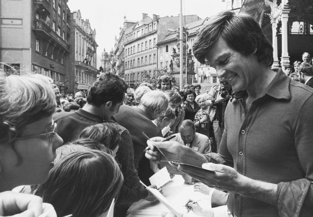 American film actor Dean Reed (1938 - 1986) signs autographs for fans in Czechoslovakia, circa 1976. Reed's left-wing political views led to settle in East Germany in 1973 and he became a major star throughout eastern Europe.