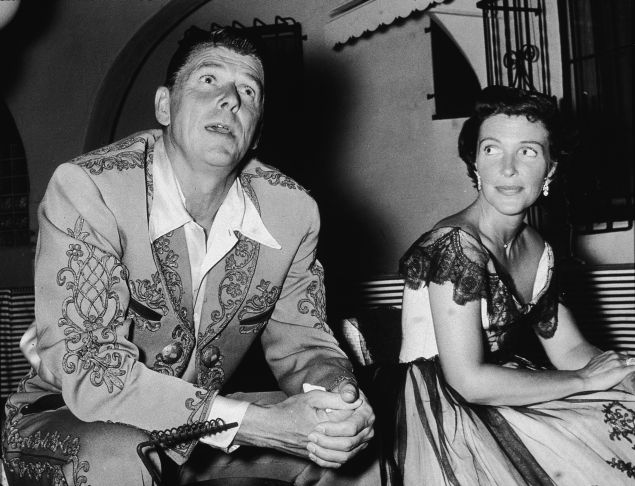 Future American president Ronald Reagan (1911 - 2004) and his wife Nancy Reagan at a costume party given by Rory Calhoun, 1950s.