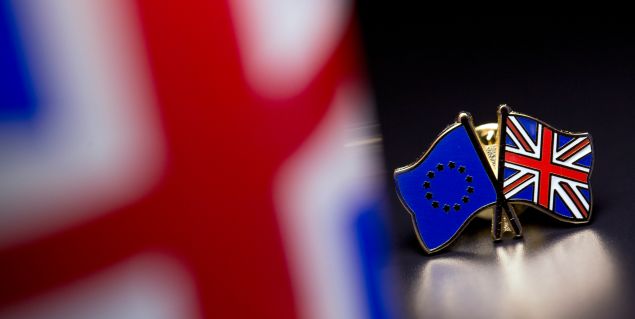 In this photo illustration, the European Union and the Union flag are pictured on a pin badge on March 17, 2016 in London, United Kingdom.
