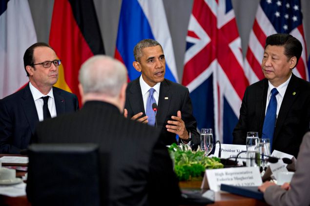 U.S. President Barack Obama (C) speaks as Xi Jinping, China's president (R), and Francois Hollande, France's president (L), listen during a P5+1 multilateral meeting at the Nuclear Security Summit on April 1, 2016 in Washington, D.C. After a spate of terrorist attacks from Europe to Africa.