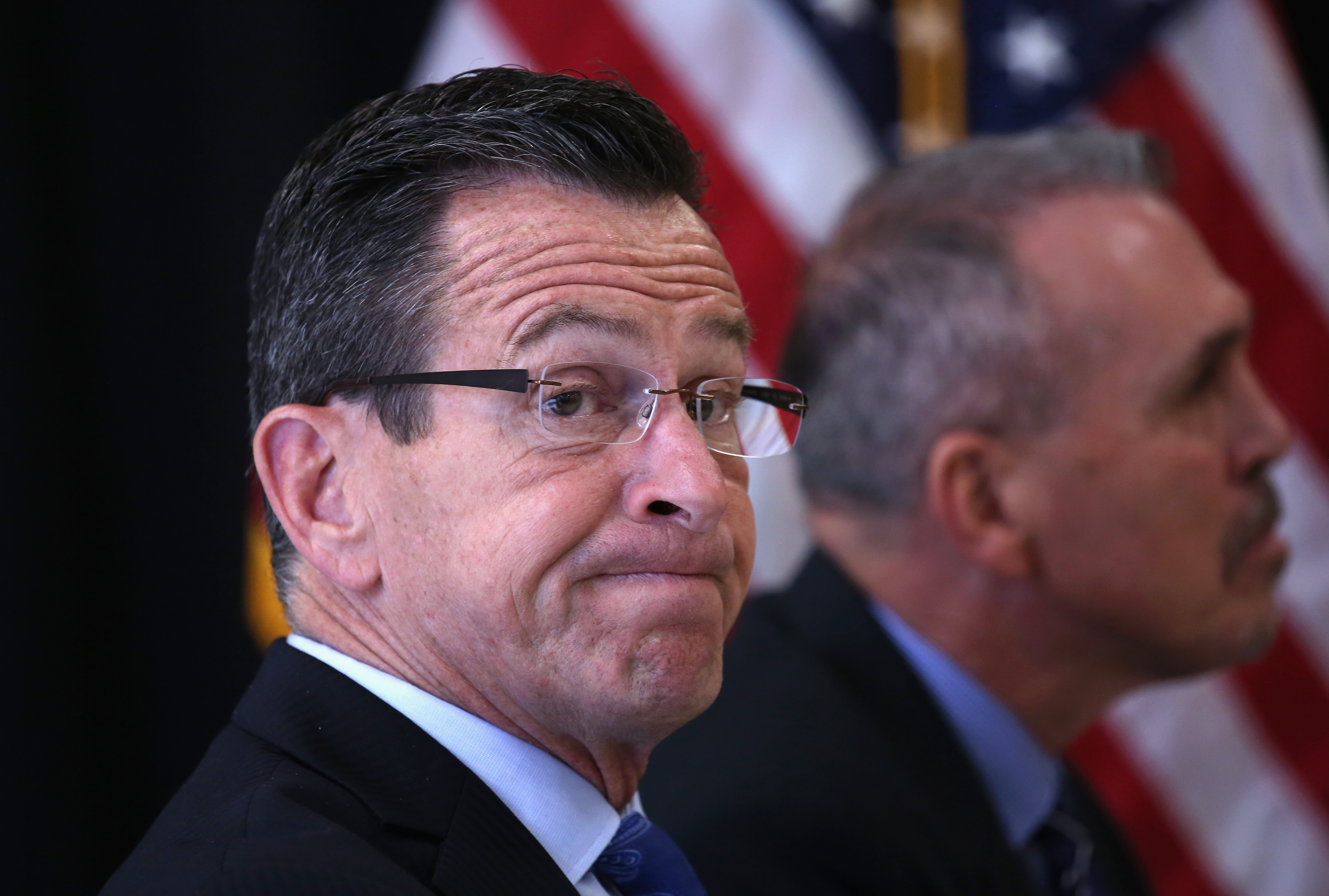 Connecticut Governor Dannel Malloy sits during the dedication ceremony of the new DUI unit of the Cybulski Community Reintegration Center on April 1, 2016 in Enfield, Connecticut. Malloy's "Second Chance Society" which he signed into law in July 2015, is considered the cutting edge of progressive criminal justice reform efforts nationwide. The DUI unit is designed to prepare non-violent inmates convicted of driving under the influence of drugs or alcohol for reintegration into society at the end of their prison sentences. The initiative is also supported by Mothers Against Drunk Driving.