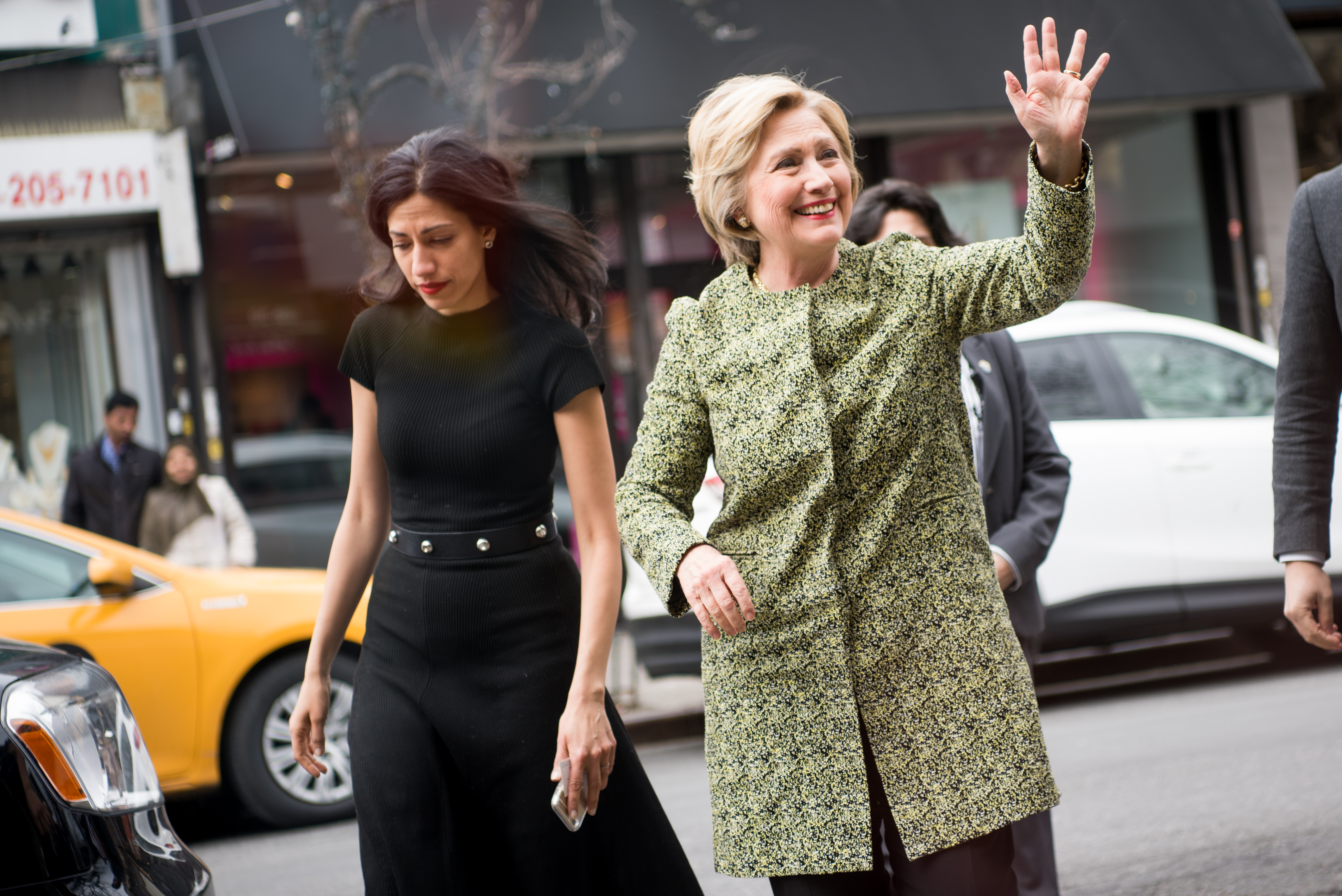 NEW YORK, NY - APRIL 11: Democratic presidential candidate Hillary Clinton (R) waves as she arrives to talk with patrons at the Jackson Diner on April 11, 2016 in the Flushing neighborhood of the Queens borough of New York City. The New York Democratic primary is scheduled for April 19th.