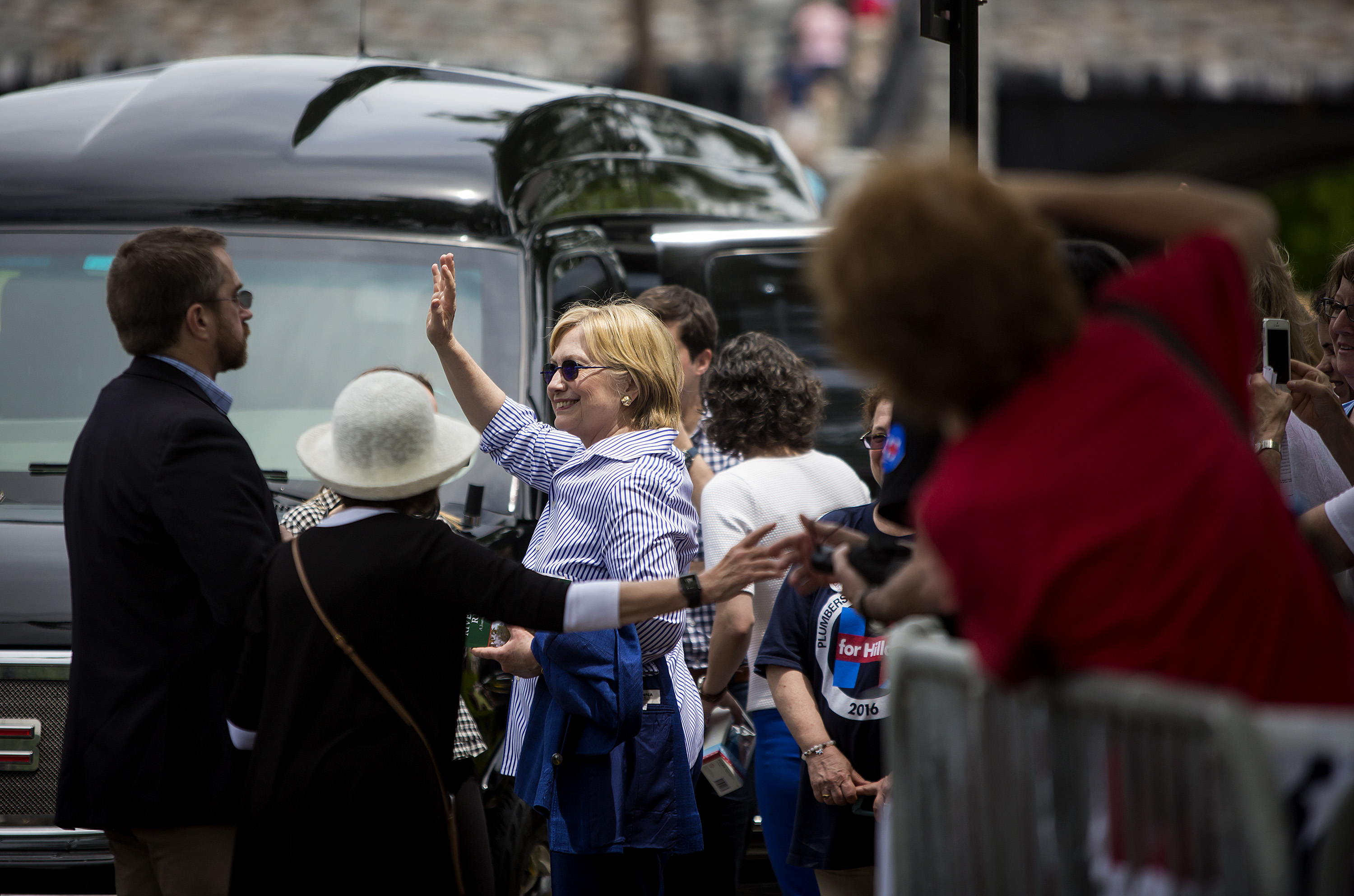 Democratic presidential candidate former Secretary of State Hillary Clinton departs after walking in the Memorial Day parade May 30, 2016 in Chappaqua, New York. 