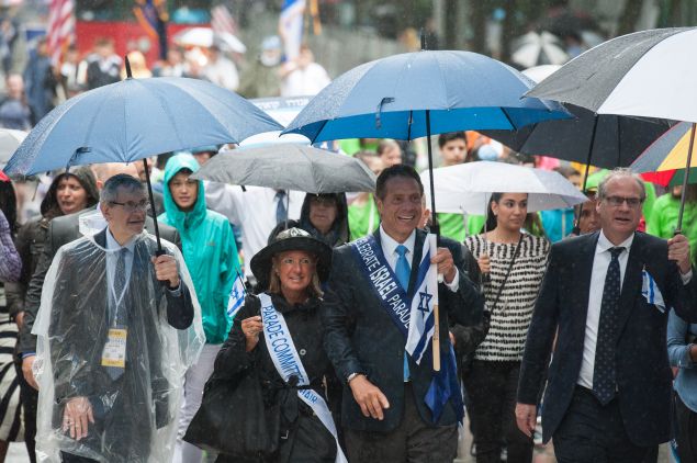 New York Gov. Andrew Cuomo marches in the Celebrate Israel Parade in the rain on June 5, 2016 in New York City.