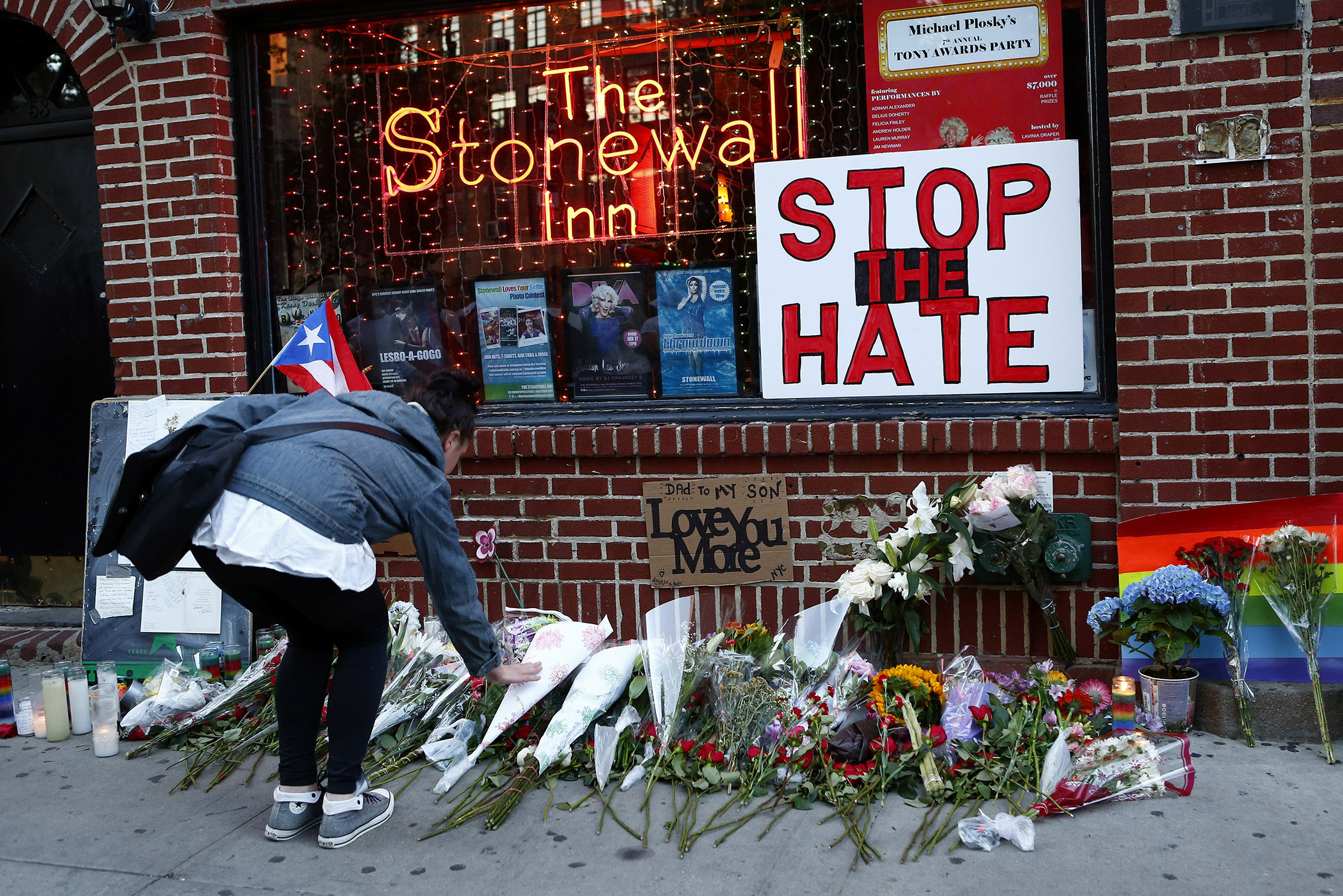 Flowers are placed at a make-shift memorial in front of the Stonewall Inn.