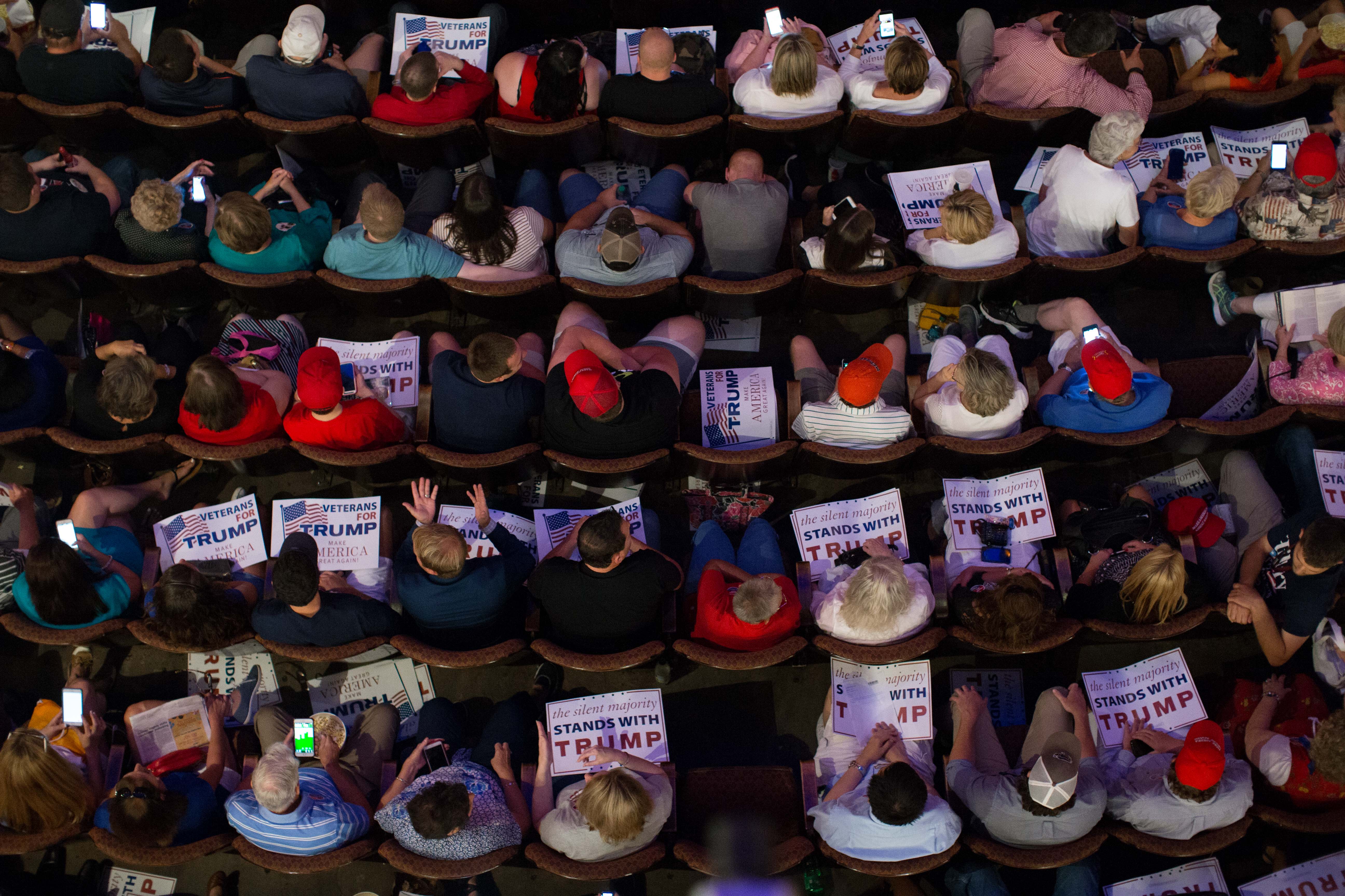 People wait in their seats to see Republican presidential candidate Donald Trump speak at The Fox Theatre during a campaign stop on June 15, 2016 in Atlanta, Georgia. Trump and Democratic presidential candidate Hillary Clinton continue to speak out on national security and immigration issues in the wake of the mass shooting in Orlando, Florida.