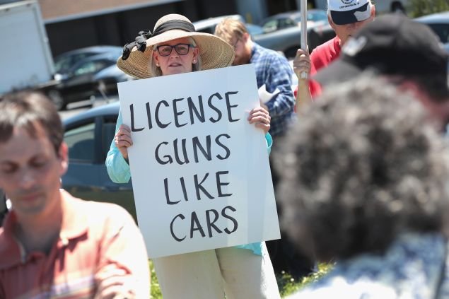 Anti-gun demonstrators protest outside DSA Inc. on June 17, 2016 in Lake Barrington, Illinois. DSA Inc. is a manufacturer of FAL, AR15 and RPD rifles.