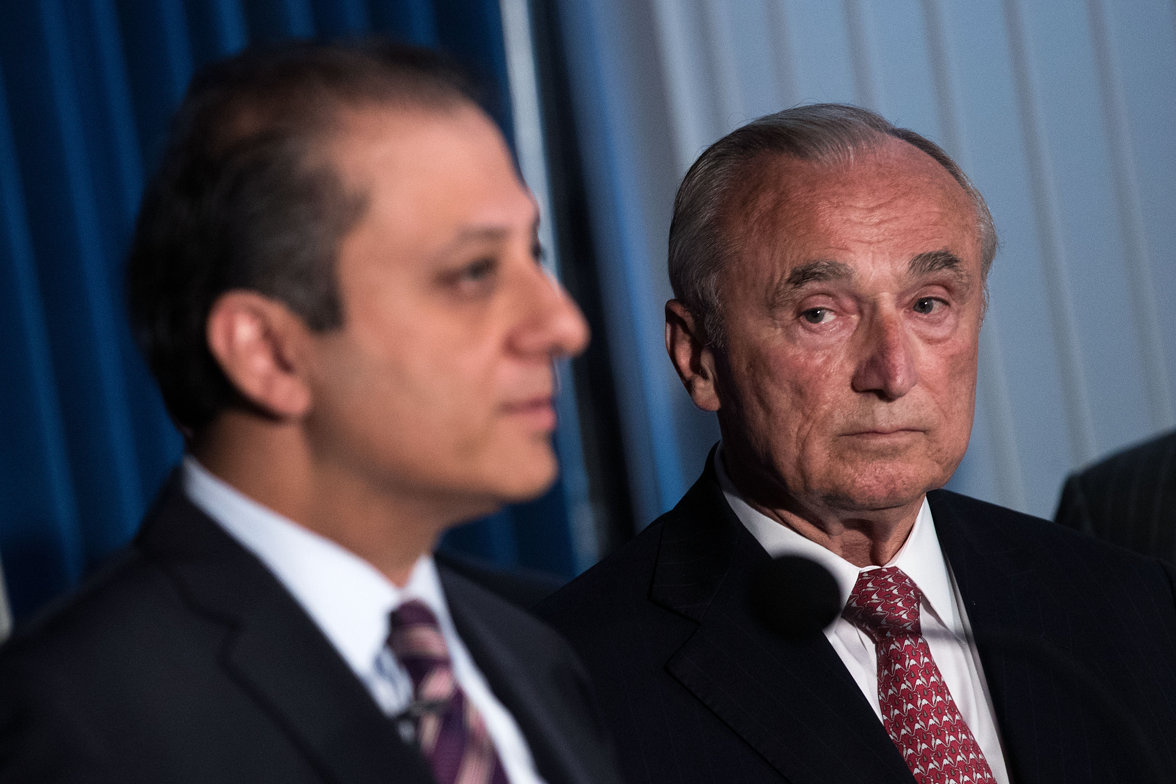 NYPD Commissioner Bill Bratton, right, looks on as U.S. Attorney Preet Bharara, outlines an NYPD corruption case.