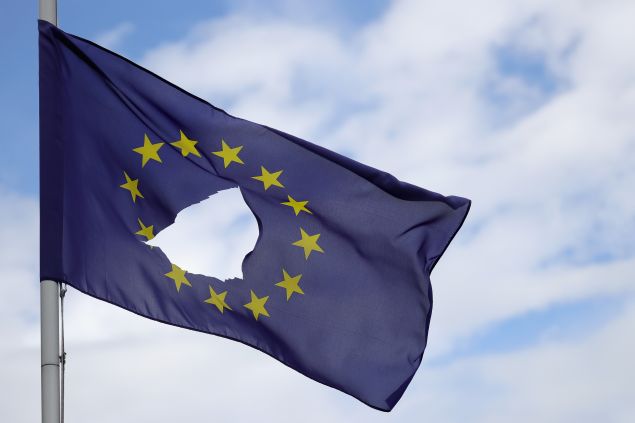 KNUTSFORD, UNITED KINGDOM - JUNE 24: A European Union flag, with a hole cut in the middle, flies at half-mast outside a home in Knutsford Cheshire after today's historic referendum on June 24, 2016 in Knutsford, United Kingdom. The results from the historic EU referendum has now been declared and the United Kingdom has voted to LEAVE the European Union.