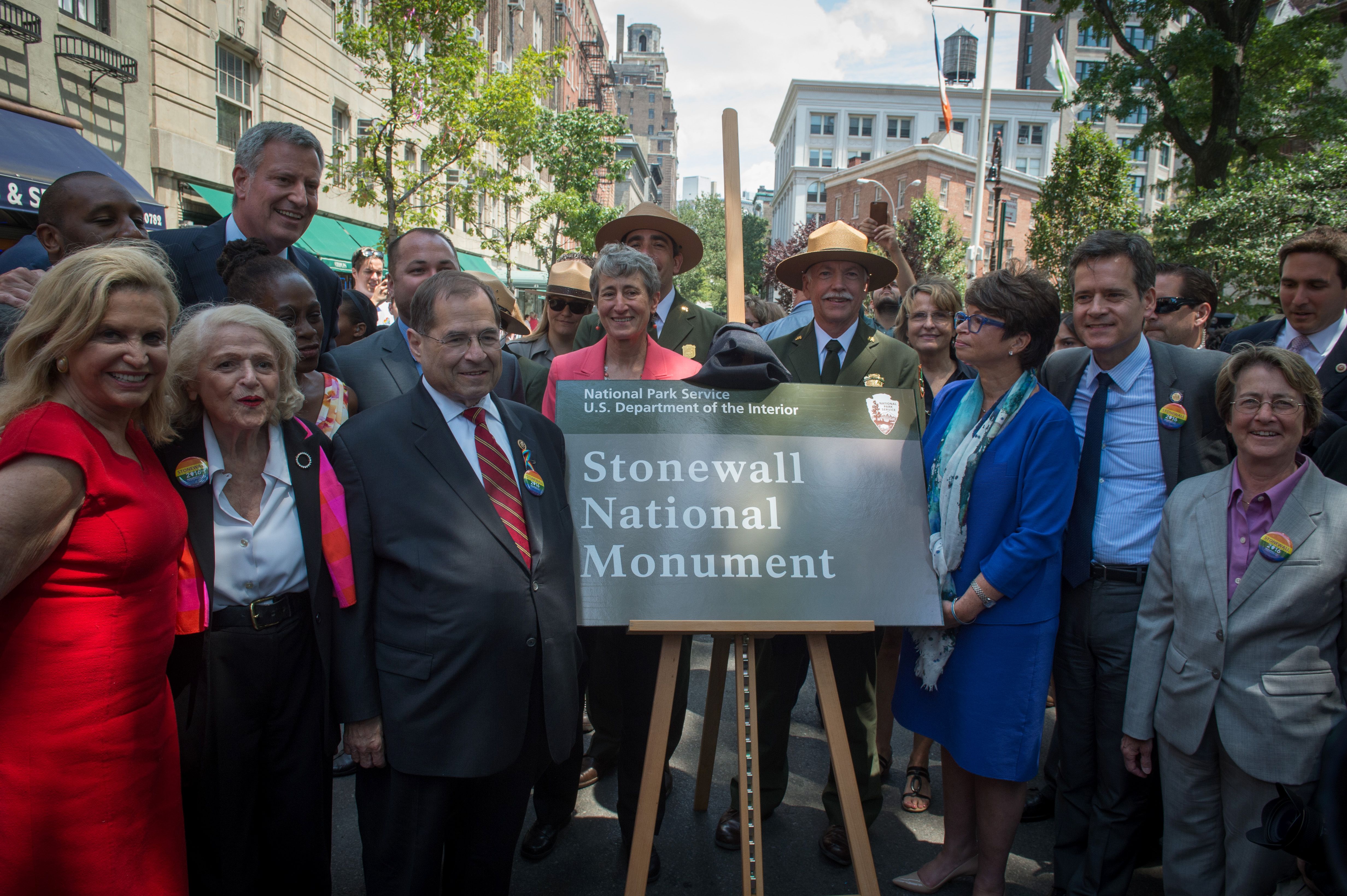 New York officials and activists unveil the sign designating Stonewall Inn a National Monument.