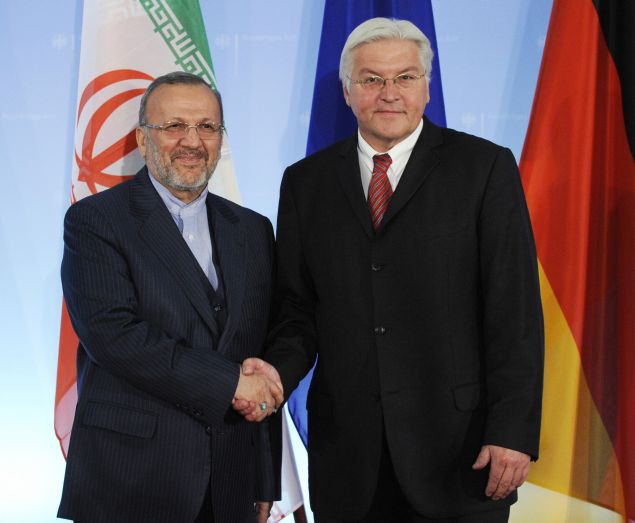 German Foreign Minister Frank-Walter Steinmeier (R) greets Iranian Foreign Minister Manouchehr Mottaki prior to talks on Tehran's disputed nuclear programme at the foreign ministry in Berlin September 15, 2008. The Berlin talks are part of a series of meetings between the European Union and Iran over Tehran's nuclear work and were initiated by Mottaki. AFP PHOTO JOHN MACDOUGALL