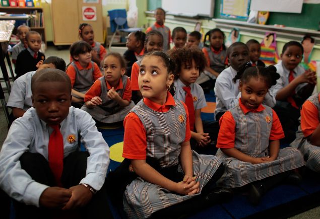 Students wait for their teacher at Harlem Success Academy, a free, public elementary charter school.