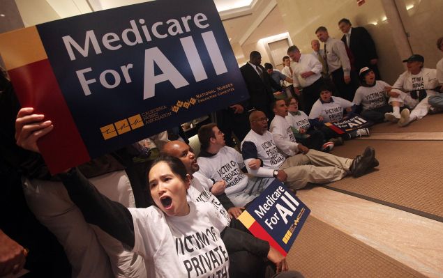 NEW YORK - SEPTEMBER 29: Health care reform supporters participate in a sit-in inside the lobby of a building where Aetna insurance offices are located. The protesters were eventually arrested by NYPD.