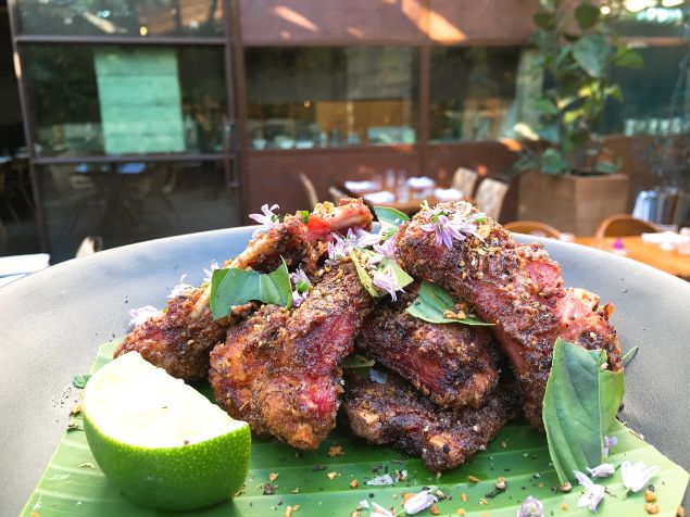 The wild boar ribs at Hinoki & the Bird are dusted with cumin and Szechuan peppercorns.