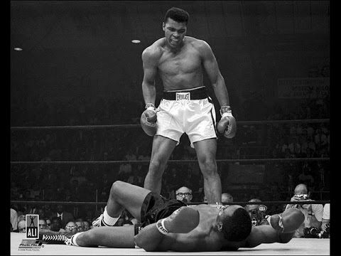 Muhammad Ali floors Sonny Liston.