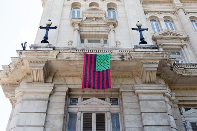 A David Hammons flag piece hanging on the Museo Nacional de Bellas Artes in Havana, Cuba.