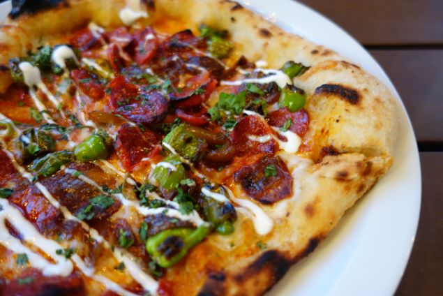 Baldoria's Caliente pizza pops with chorizo arrabbiata and shishito peppers.
