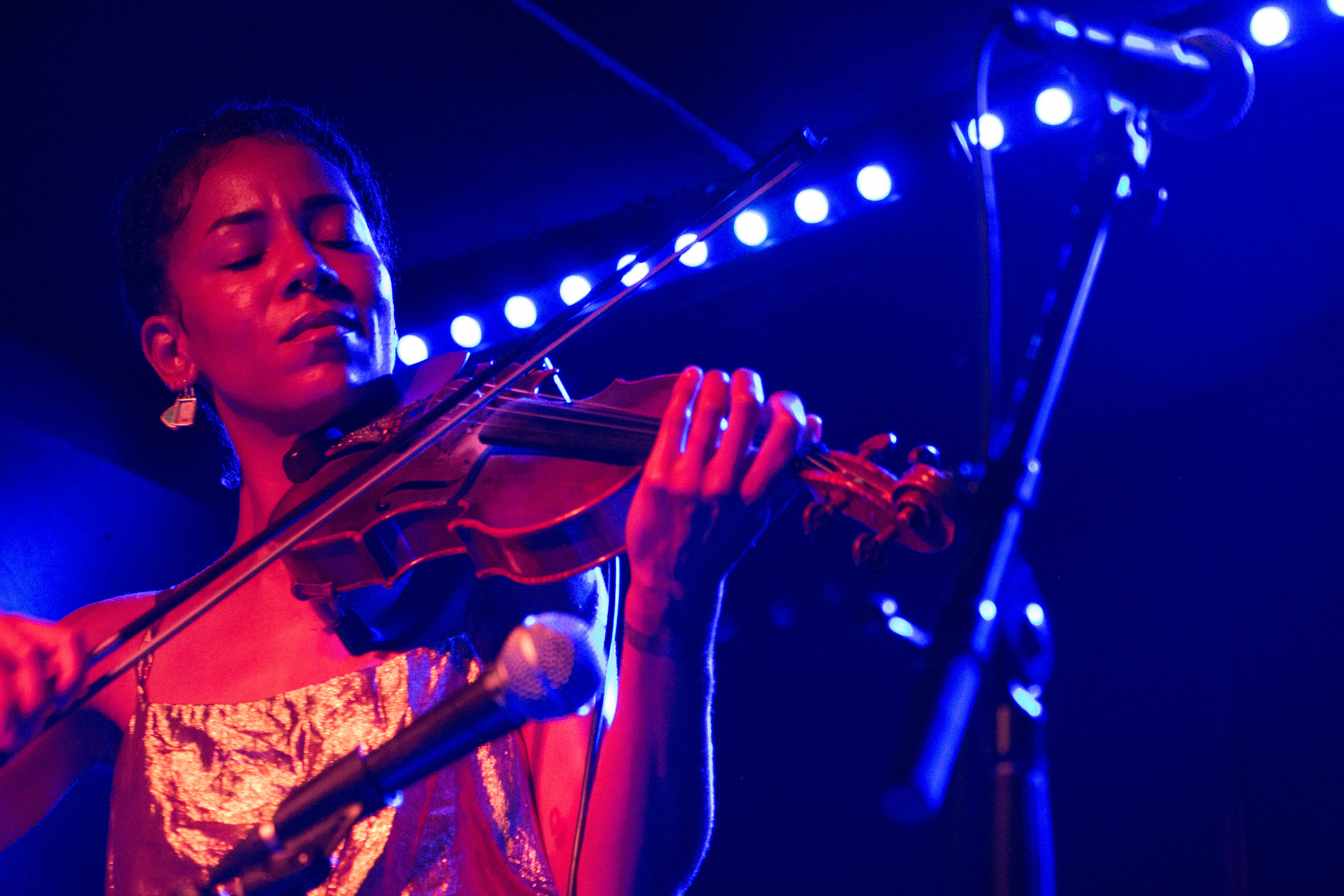 Charles plays her bejeweled violin