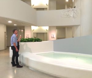 A couple looking at a Moholy-Nagy sculpture.