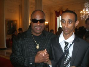 Mussie with Stevie Wonder at the White House