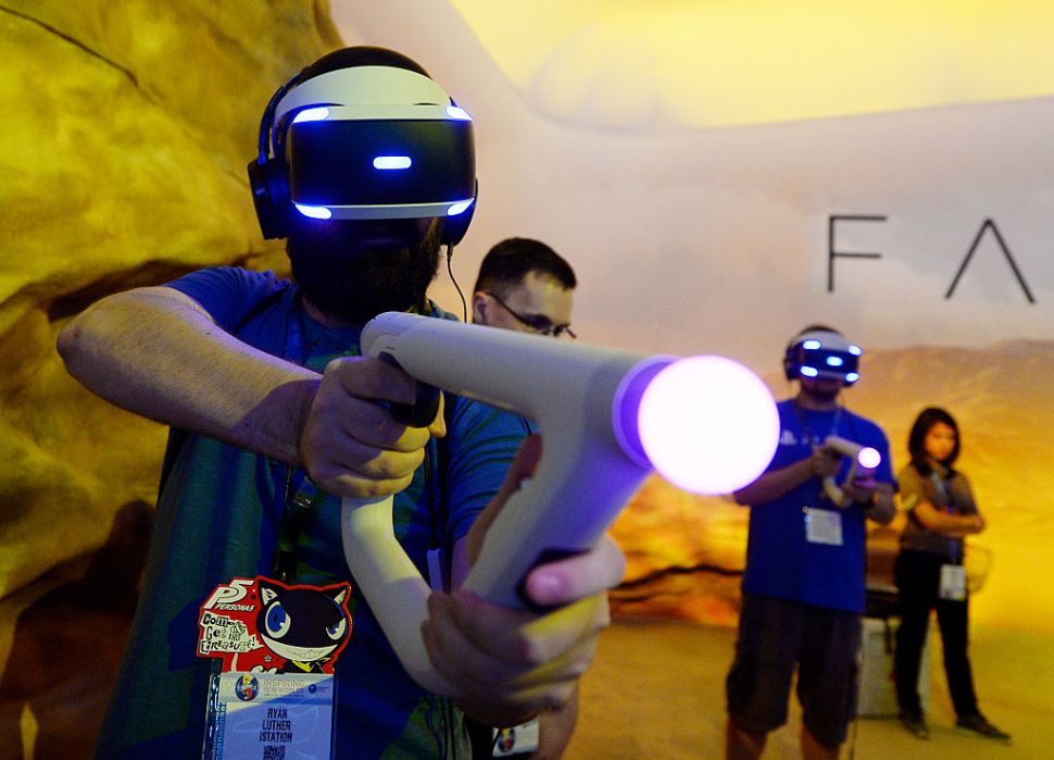 Gamers try out the new Sony VR headset in Sony Playstation booth during the annual E3 2016 gaming conference at the Los Angeles Convention Center on June 14, 2016 in Los Angeles, California. The Electronic Entertainment Expo will run from June 14 -16.