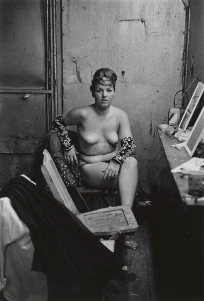 Stripper with bare breasts sitting in her dressing room, Atlantic City, N.J. 1961.