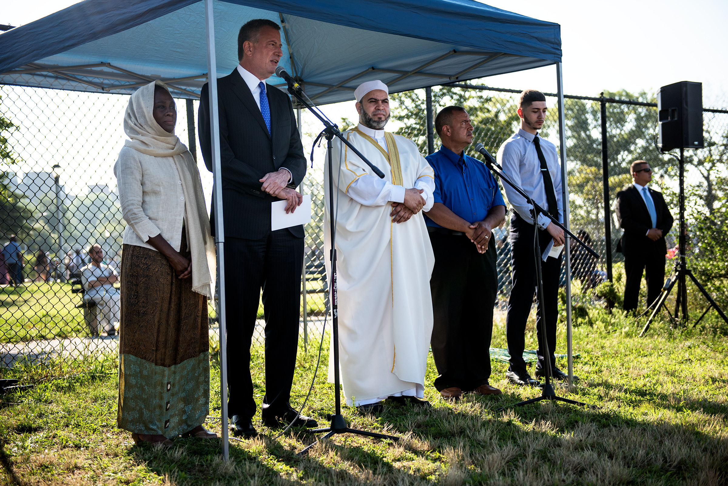 Mayor Bill de Blasio and First Lady Chirlane McCray speak at an Eid al-Fitr prayer at Bensonhurst Park in Brooklyn.