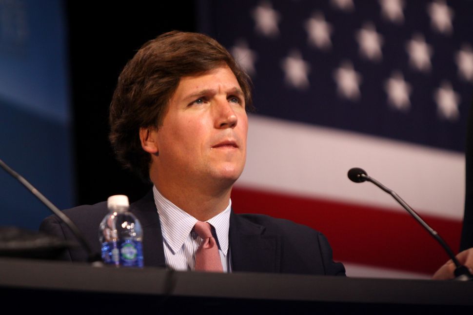 Tucker Carlson, who founded The Daily Caller.