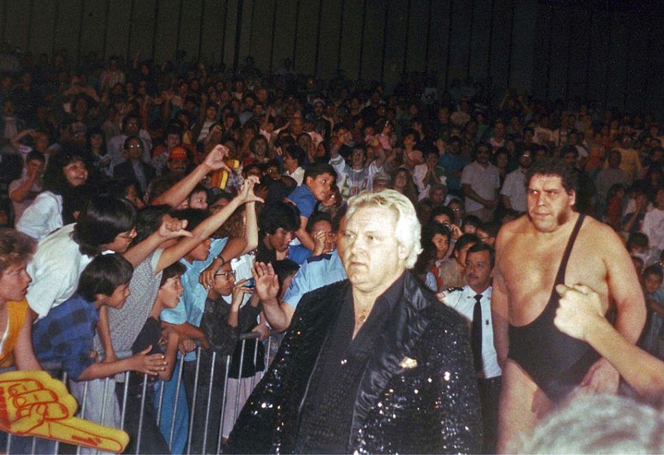 Bobby "The Brain" Heenan leads Andre the Giant to the ring for a WWF bout.