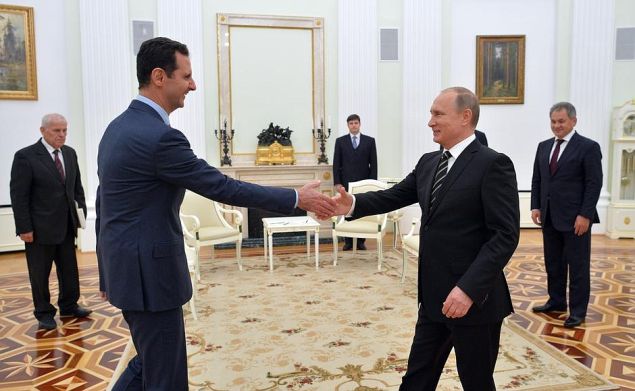 Bashar Assad greets Vladimir Putin.