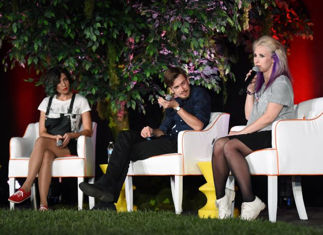 LAS VEGAS, NV - OCTOBER 24: (L-R) Founding member of the art collective Pussy Riot Nadezhda "Nadya" Tolokonnikova, her husband and translator, Pyotr Verzilov and Pussy Riot founding member Maria "Masha" Alekhina speak at the Life is Beautiful festival on October 24, 2014 in Las Vegas, Nevada.