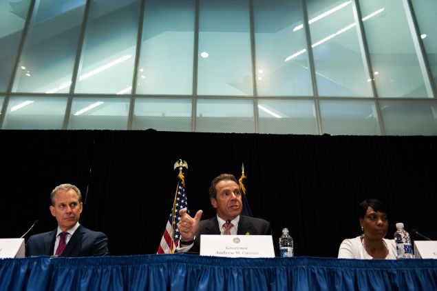 Gov. Andrew Cuomo, center, with Attorney General Eric Schneiderman, left. 