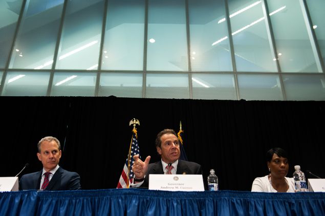 Gov. Andrew Cuomo, center, with Attorney General Eric Schneiderman, left.