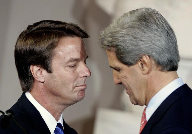 BOSTON, UNITED STATES: Former Democratic presidential candidate John Kerry(R) stands with running mate John Edwards at his concession speech in Faneuil Hall 03 November 2004 in Boston, Massachusetts. Kerry phoned US President George W. Bush at the White House earlier 03 November to concede the US presidential election. AFP PHOTO/ JEFF HAYNES