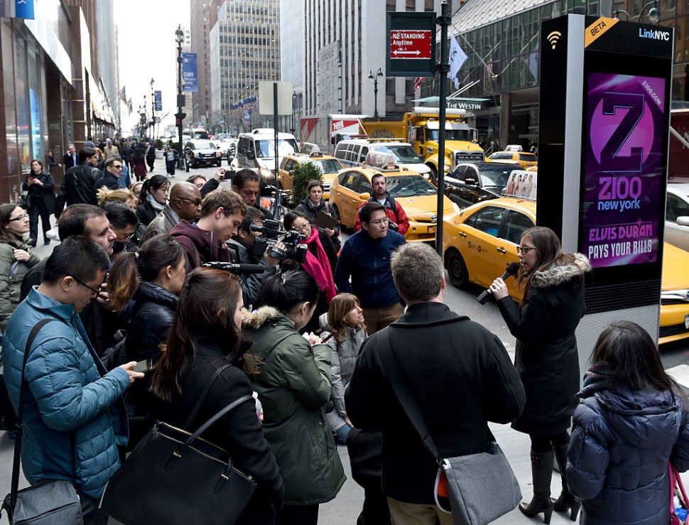 Foreign press are given a tour by the New York Foreign Press Center as they are shown a kiosk on 3rd Avenue introducing LinkNYC, New York Citys Free Superfast Broadband Experiment on March 21,2016. / AFP / Timothy A. CLARY (Photo credit should read TIMOTHY A. CLARY/AFP/Getty Images)