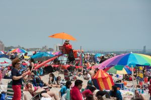 NEW YORK, NY - MAY 29: A life guard watches beach goers in Coney Island on May 29, 2016 in the Brooklyn borough of New York City. New York City is experiencing higher than average temperatures for the holiday weekend. (Photo by Stephanie Keith/Getty Images)