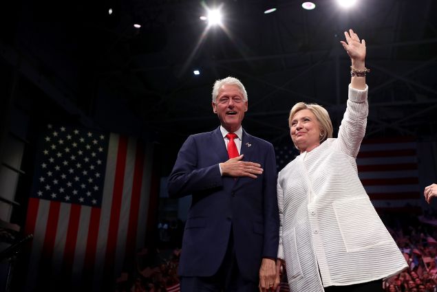 BROOKLYN, NY - JUNE 07: Democratic presidential candidate former Secretary of State Hillary Clinton (R) and her husband former U.S. president Bill Clinton greet supporters during a primary night event on June 7, 2016 in Brooklyn, New York. Hillary Clinton surpassed the number of delegates needed to become the Democratic nominee over rival Bernie Sanders with a win in the New Jersey presidential primary.
