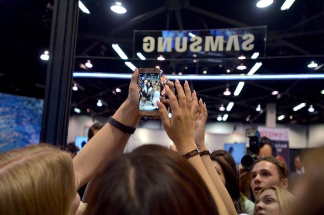ANAHEIM, CA - JUNE 23: VidCon attendees take a selfie with a Samsung Galaxy S7 at the Samsung Experience At VidCon 2016 on June 23, 2016 in Los Angeles, California.