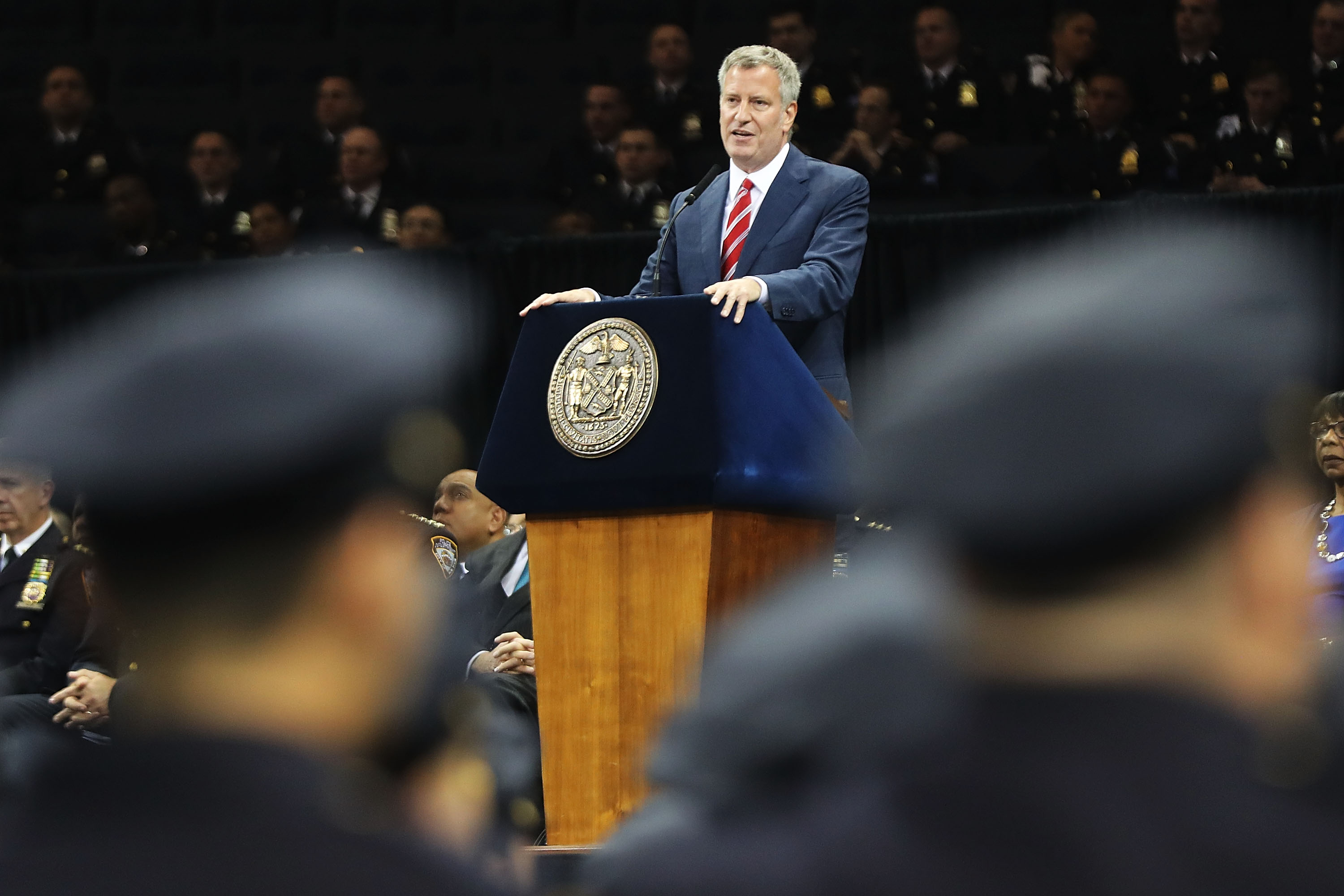 New York City Mayor Bill de Blasio speaks to new members of New York City's police department's graduating class during a swearing in ceremony at Madison Square Garden on July 1, 2016 in New York City. 
