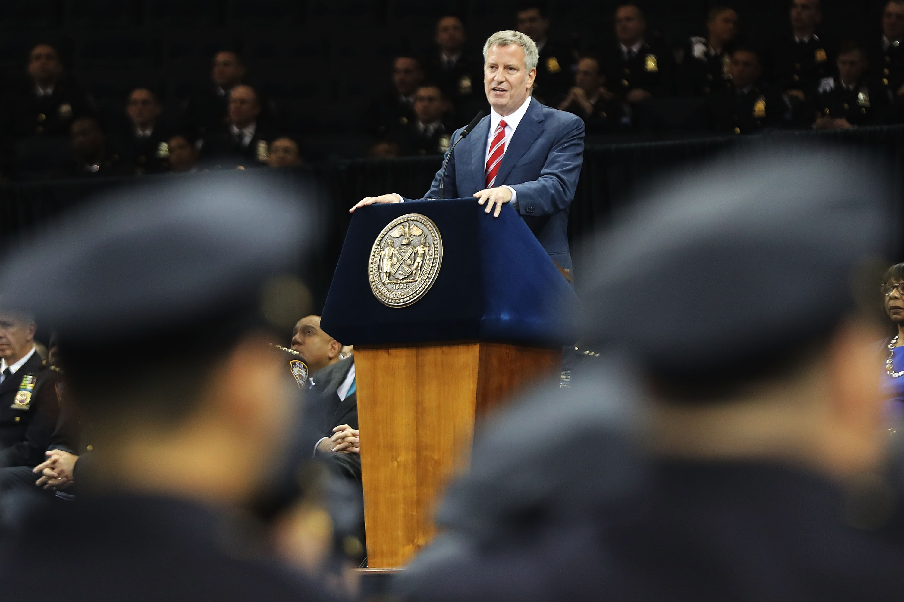 New York City Mayor Bill de Blasio speaks to new members of New York City's police department's graduating class during a swearing in ceremony at Madison Square Garden on July 1, 2016 in New York City.