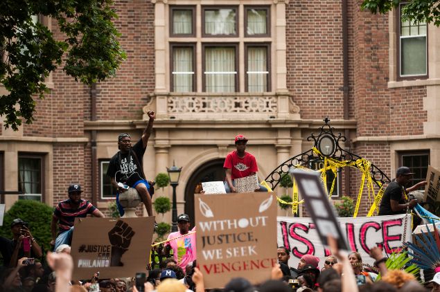 Activists and community members protest the killing of Philando Castile outside the Governor's Mansion in St. Paul, Minnesota.