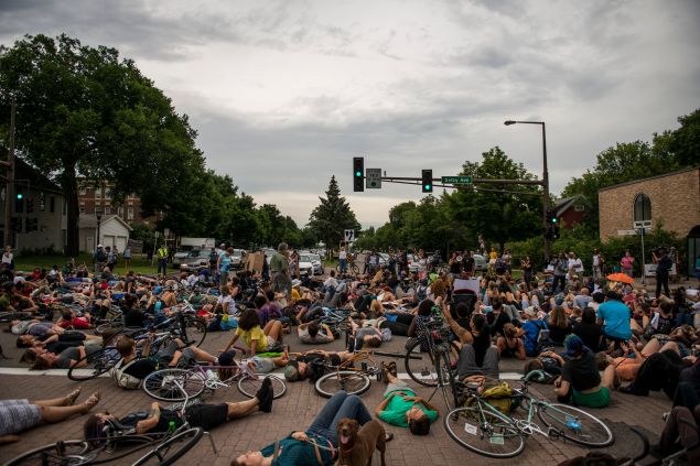 Protestors lie in an intersection during a demonstration for Philando Castile in St. Paul, Minnesota.
