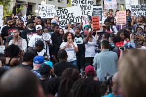 Protestors hold signs in Dallas, Texas.