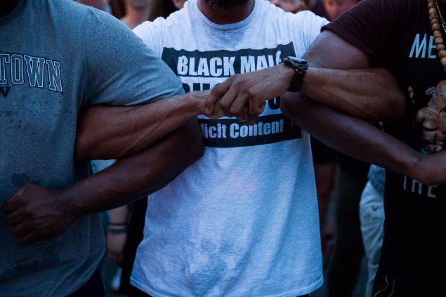 Demonstrators lock arms as they march from The White House to Capitol Hill. 