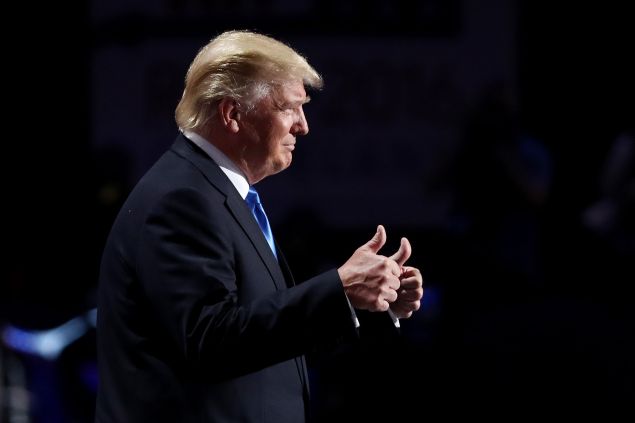 CLEVELAND, OH - JULY 18: Presumptive Republican presidential nominee Donald Trump gives thumbs up while introducing his wife Melania on the first day of the Republican National Convention on July 18, 2016 at the Quicken Loans Arena in Cleveland, Ohio. An estimated 50,000 people are expected in Cleveland, including hundreds of protesters and members of the media. The four-day Republican National Convention kicks off on July 18.