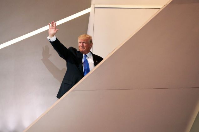 CLEVELAND, OH - JULY 18: Presumptive Republican presidential nominee Donald Trump waves to the crowd while exiting the stage after his wife Melania after she delivered a speech on the first day of the Republican National Convention on July 18, 2016 at the Quicken Loans Arena in Cleveland, Ohio. An estimated 50,000 people are expected in Cleveland, including hundreds of protesters and members of the media. The four-day Republican National Convention kicks off on July 18.