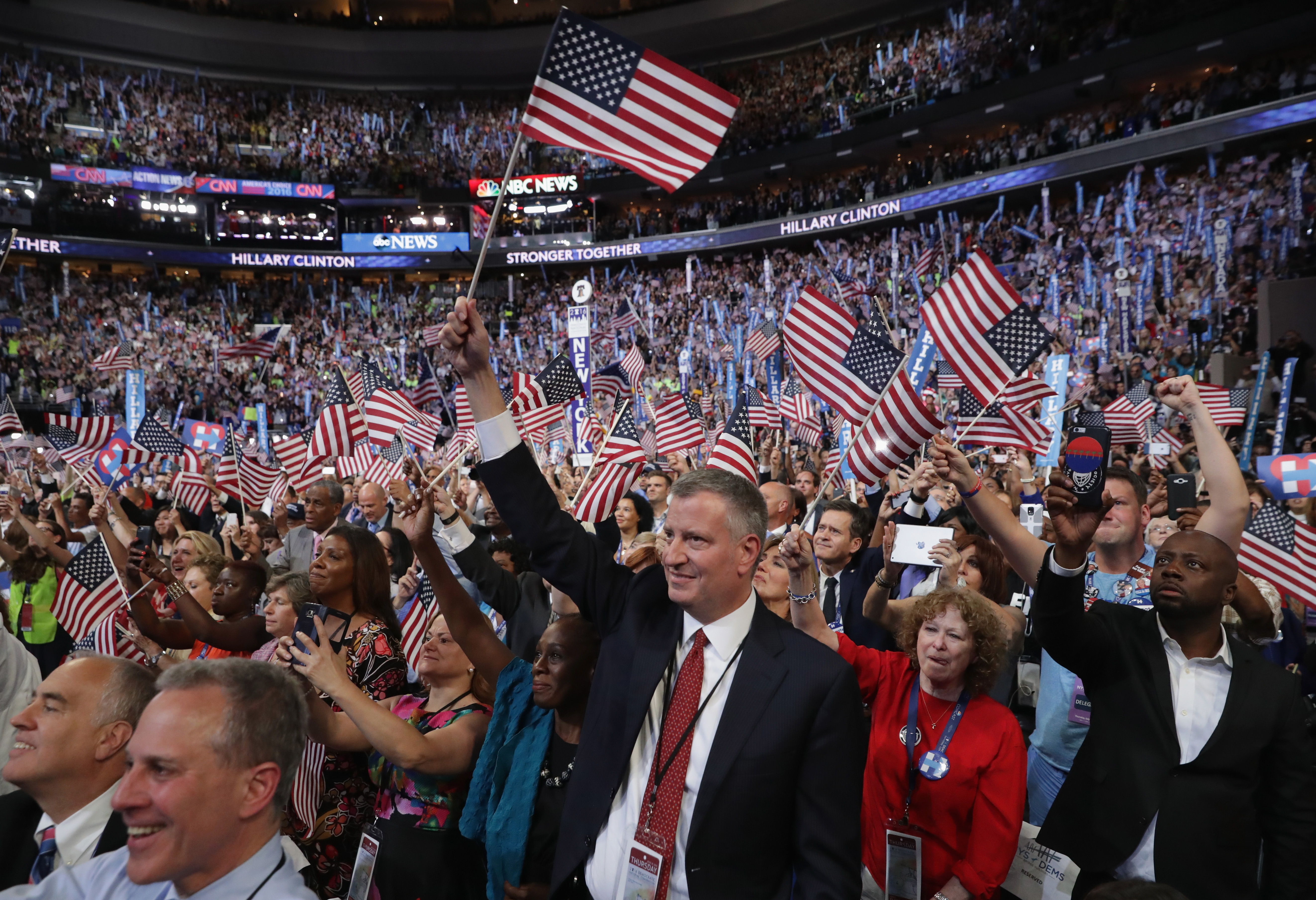 New York City Mayor Bill de Blasio cheers with delegates at the end of the fourth day of the Democratic National Convention 