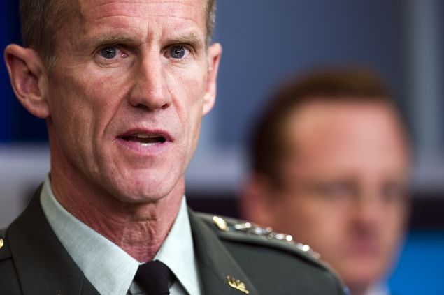 US commander in Afghanistan General Stanley McChrystal (R) speaks during a press briefing with White House spokesman Robert Gibbs (rear) and US Ambassador to Afghanistan Karl Eikenberry (not seen)at the White House in Washington, DC, May 10, 2010. McChrystal, the top NATO commander in Afghanistan, on Monday predicted "increased violence" in the country but said President Barack Obama's surge strategy would ultimately succeed. AFP PHOTO/Jim WATSON 