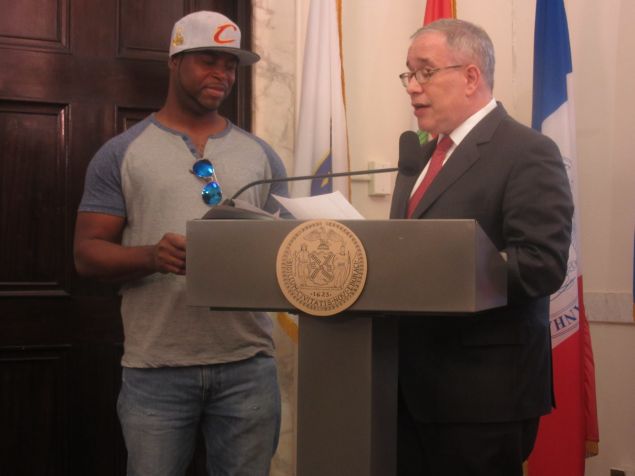 Comptroller Scott Stringer presents a $50,000 check to Bronx resident Wilson Lopez.